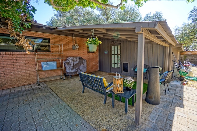 view of patio with a grill