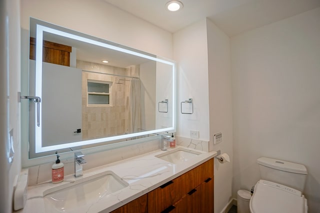 bathroom featuring a shower with curtain, vanity, and toilet