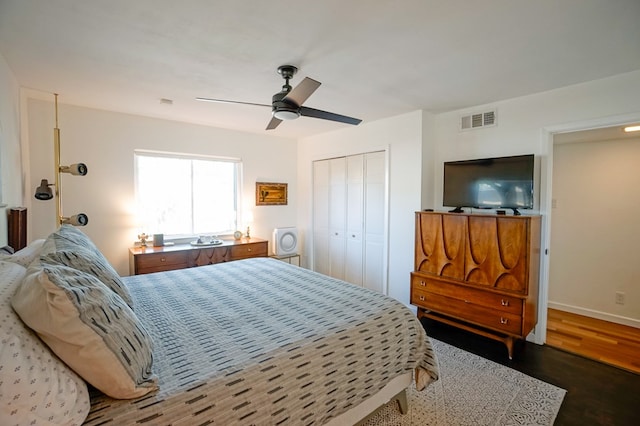 bedroom featuring hardwood / wood-style flooring, a closet, and ceiling fan