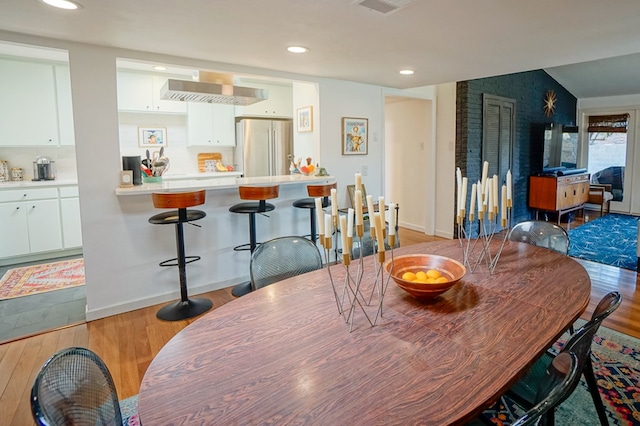 dining area featuring wood-type flooring