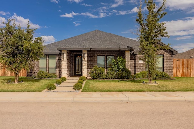 view of front of home with a front lawn