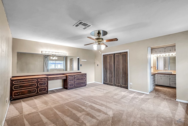 1510 W School St, Stanton, TX 79782 - full bath with two vanities, baseboards, and a ceiling fan