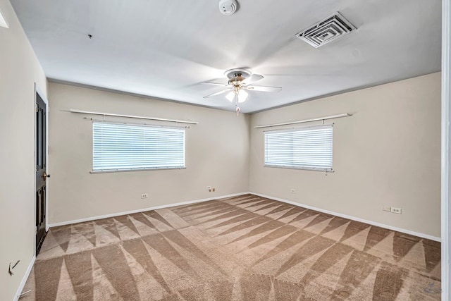 1510 W School St, Stanton, TX 79782 - carpeted spare room featuring a smoke detector, healthy amount of natural light, baseboards, and a ceiling fan