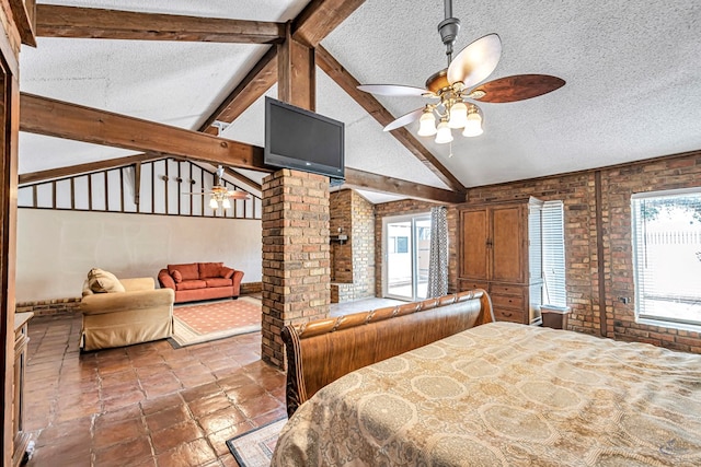 1510 W School St, Stanton, TX 79782 - bedroom with a textured ceiling, vaulted ceiling, and brick wall