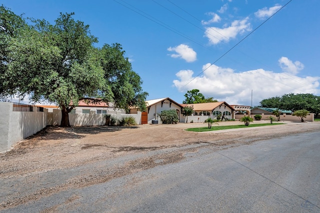 1510 W School St, Stanton, TX 79782 - view of front of house with dirt driveway and stucco siding