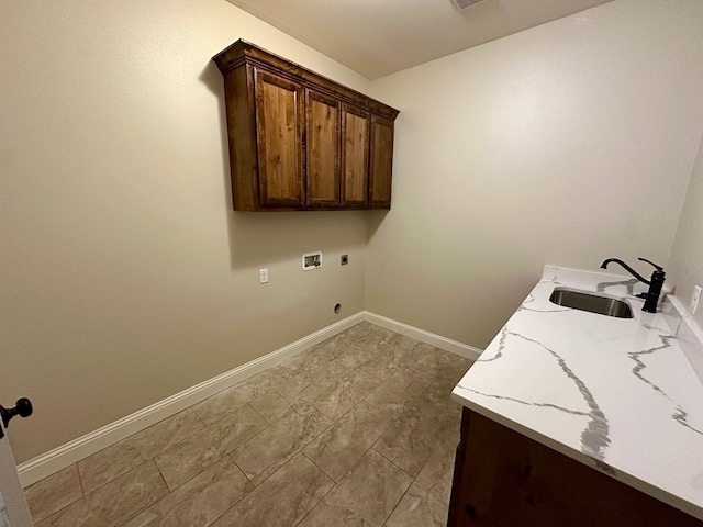 laundry area with a sink, cabinet space, hookup for an electric dryer, washer hookup, and baseboards