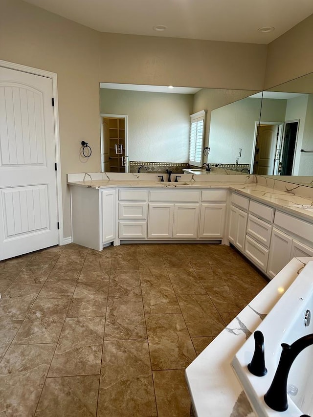 full bathroom featuring double vanity and tile patterned flooring
