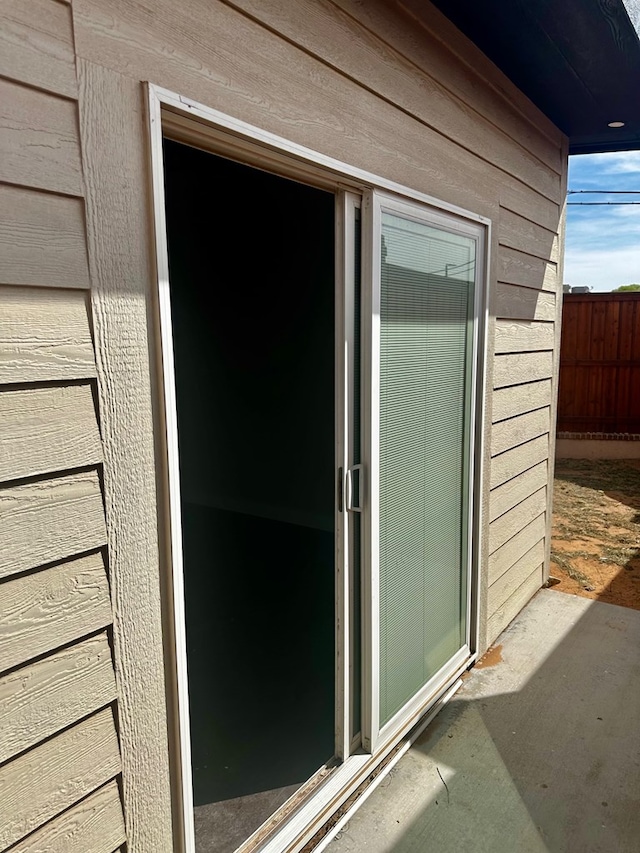 property entrance featuring fence