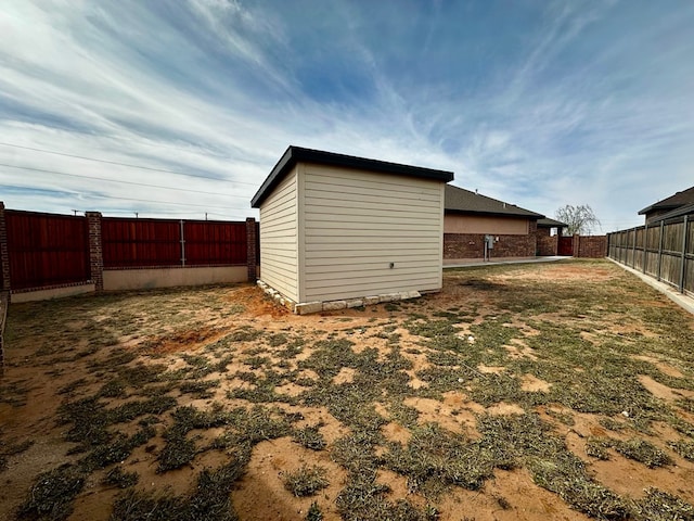 view of outbuilding featuring a fenced backyard