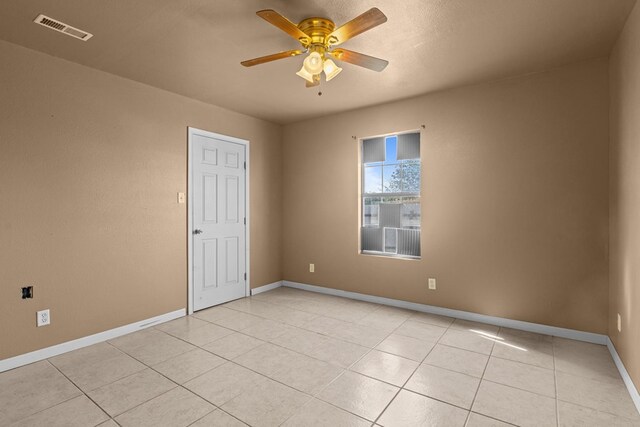 610 S Clay St, Midland, TX 79701 - unfurnished room featuring ceiling fan, baseboards, and light tile patterned floors