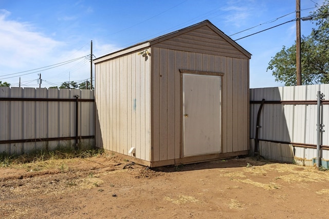 view of shed with a fenced backyard