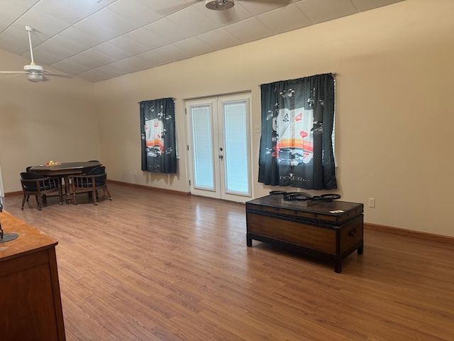 1207 Kansas, Midland, TX 79705 - living room featuring ceiling fan, light wood finished floors, and vaulted ceiling