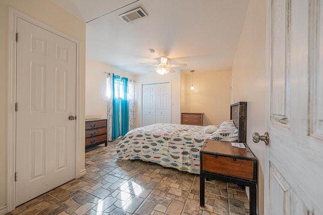 1207 Kansas, Midland, TX 79705 - bedroom featuring a ceiling fan, a closet, and stone finish floors