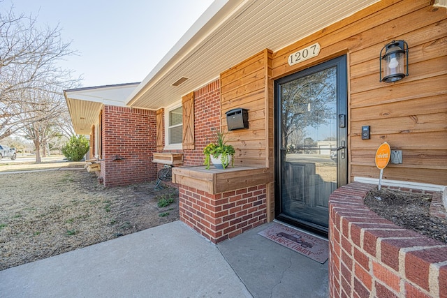 1207 Kansas, Midland, TX 79705 - property entrance featuring brick siding and a porch