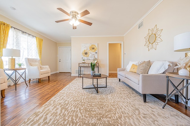 1207 Kansas, Midland, TX 79705 - living area featuring crown molding, wood finished floors, and ceiling fan