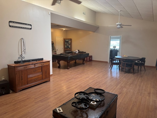 1207 Kansas, Midland, TX 79705 - living room featuring a ceiling fan, pool table, light wood finished floors, and high vaulted ceiling