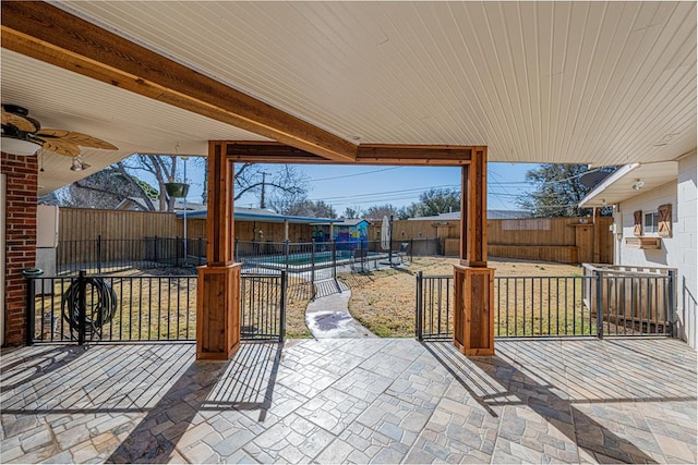 1207 Kansas, Midland, TX 79705 - fenced backyard featuring ceiling fan and a patio