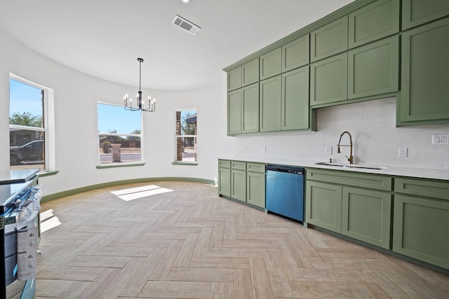 kitchen featuring sink, hanging light fixtures, a notable chandelier, appliances with stainless steel finishes, and green cabinetry