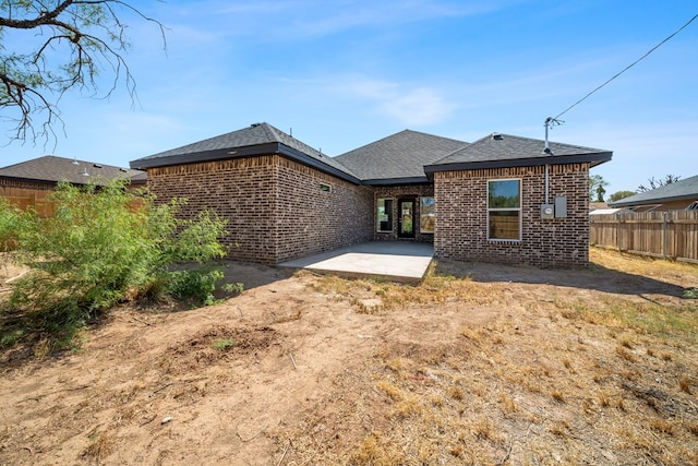 rear view of house featuring a patio