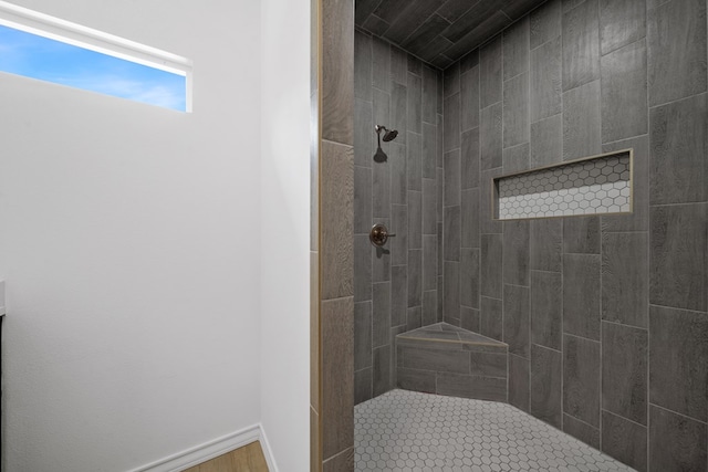 bathroom with a tile shower