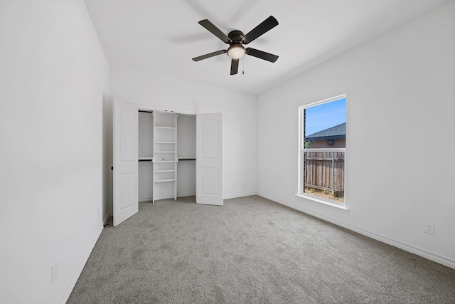 unfurnished bedroom with carpet flooring, ceiling fan, and a closet