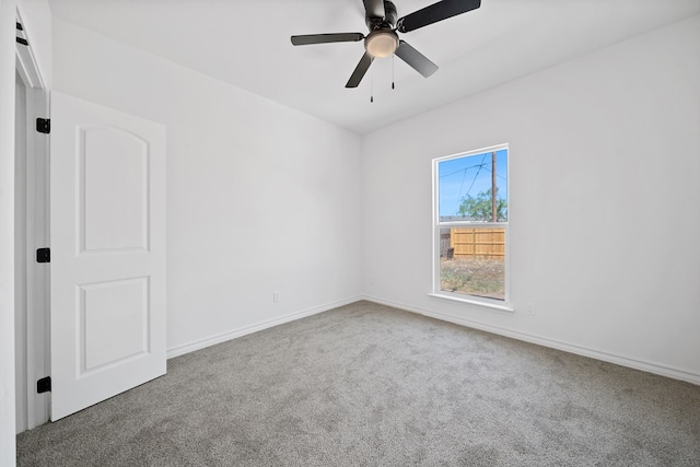 empty room featuring carpet and ceiling fan