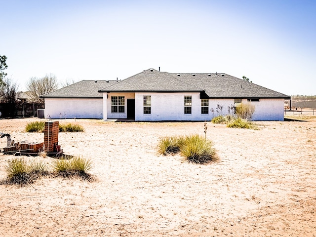 back of house with fence