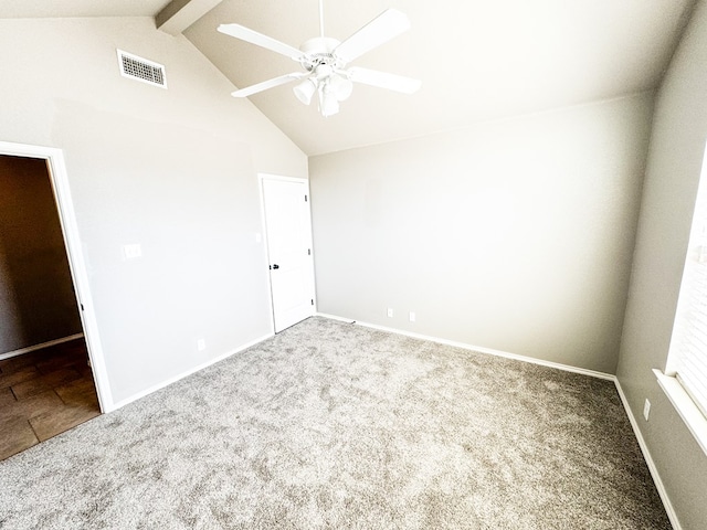 unfurnished room featuring visible vents, high vaulted ceiling, carpet floors, baseboards, and ceiling fan