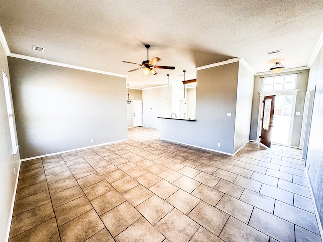 tiled spare room with visible vents, ceiling fan with notable chandelier, a textured ceiling, and ornamental molding