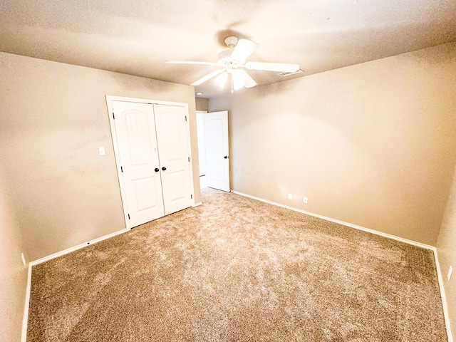 unfurnished bedroom with baseboards and carpet floors