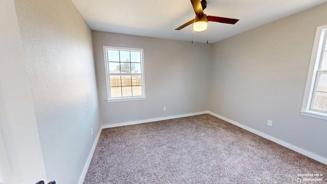 spare room featuring carpet floors, baseboards, and a ceiling fan