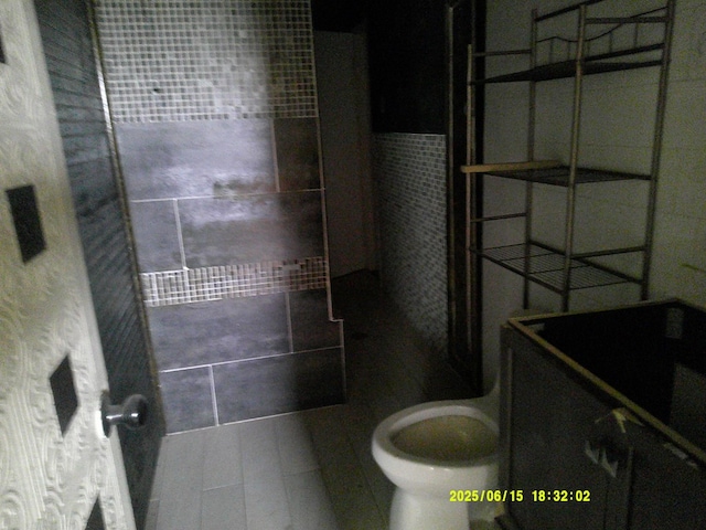 1104 S Monticello St, Big Spring, TX 79720 - bathroom with toilet and tile patterned flooring