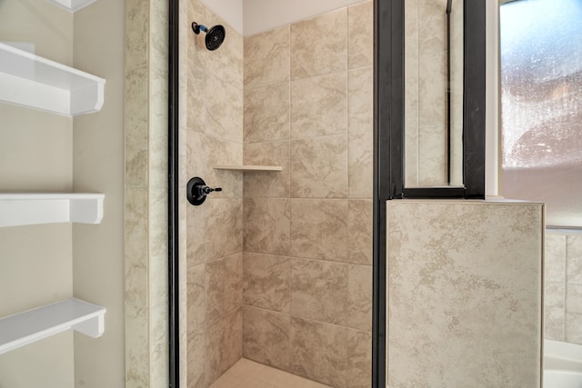 bathroom featuring tiled shower