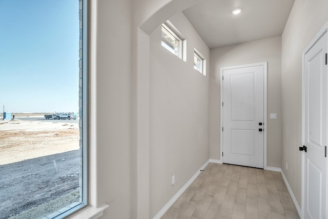 entryway with light hardwood / wood-style flooring