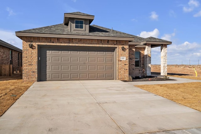 view of front of property with a garage