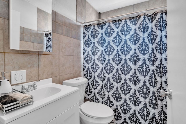 bathroom with vanity, tile walls, curtained shower, and toilet