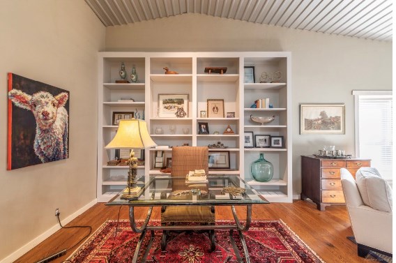 office area featuring wood-type flooring and vaulted ceiling