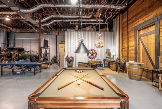 playroom with wood walls, concrete flooring, and billiards