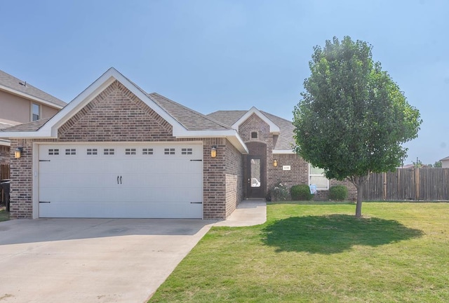 6108 Copper Sky Ct, Midland, TX 79705 - view of front facade featuring brick siding, an attached garage, and driveway