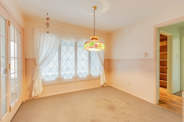 unfurnished dining area with carpet floors