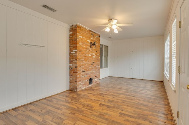 spare room with hardwood / wood-style flooring and ceiling fan