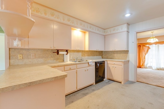 kitchen with sink, white cabinetry, light carpet, black dishwasher, and pendant lighting