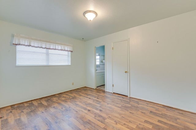 spare room featuring hardwood / wood-style flooring