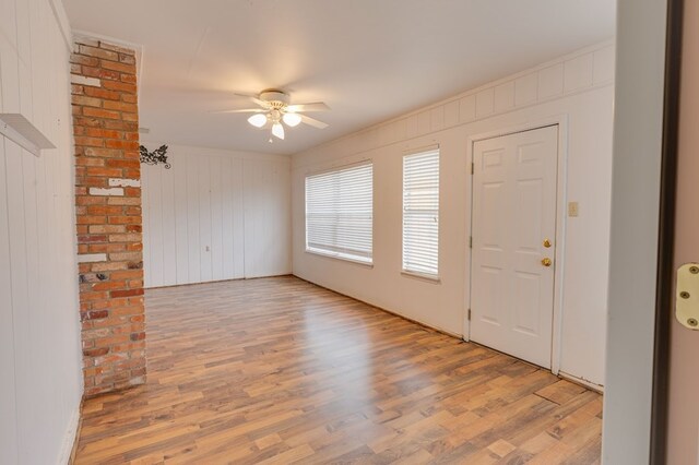 foyer featuring light hardwood / wood-style flooring and ceiling fan