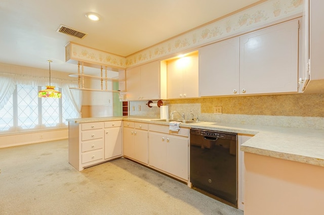 kitchen with sink, dishwasher, white cabinetry, hanging light fixtures, and light colored carpet