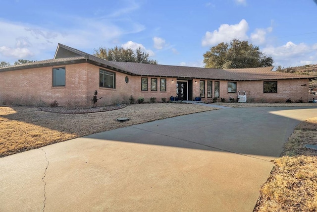 single story home with brick siding