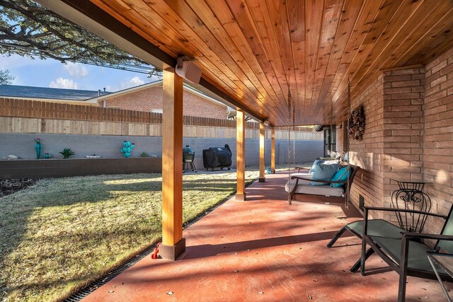 view of patio featuring fence and grilling area