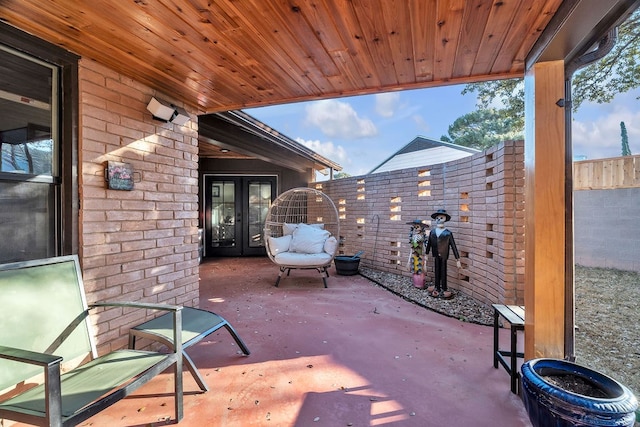 view of patio / terrace featuring french doors and a fenced backyard