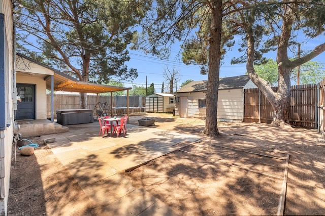 1400 W Tennessee Ave, Midland, TX 79701 - fenced backyard featuring a patio, a hot tub, and a trampoline