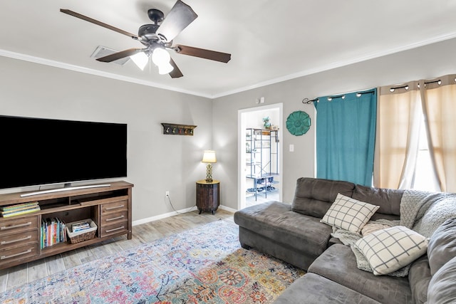 1400 W Tennessee Ave, Midland, TX 79701 - living room featuring a ceiling fan, wood finished floors, baseboards, and crown molding
